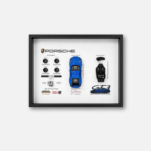 Porsche 911 GT3 992 Shark Blue Deconstructed Frame — straight-on front view of the full spec layout with the blue body shell, wheels and carbon interior