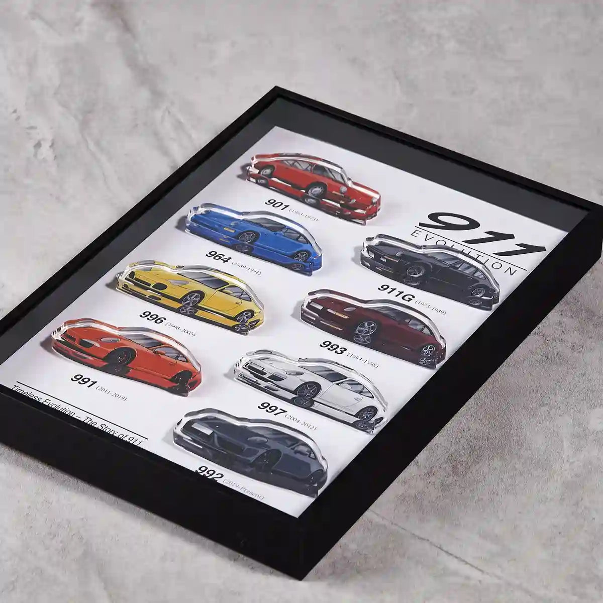 Porsche 911 Evolution 3D Framed Wall Art Display-flat lay on concrete