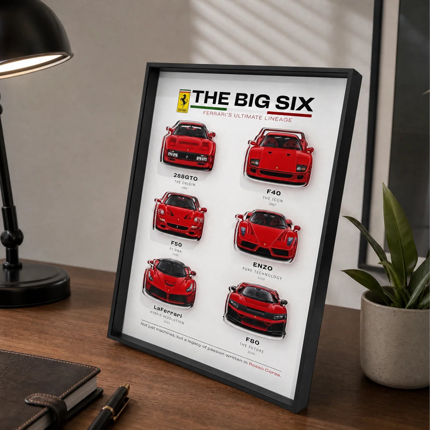 Ferrari The Big Six 3D Framed Display — standing on a dark wood desk beside a reading lamp, notebook and plant