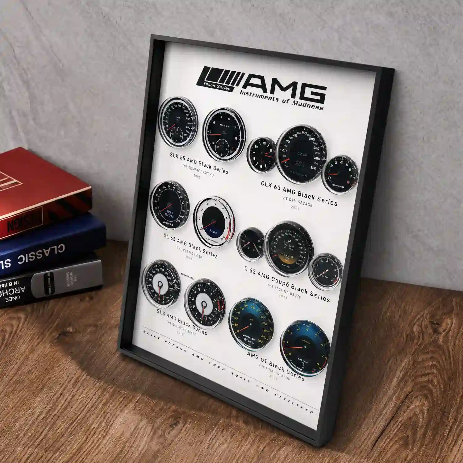 Mercedes-AMG Black Series Instruments 3D Framed Display — angled desk view with books to the left, showing the frame depth