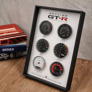 Nissan Skyline GT-R Tachometer Evolution 3D Framed Display — angled desk view showing the aluminium frame and acrylic glazing