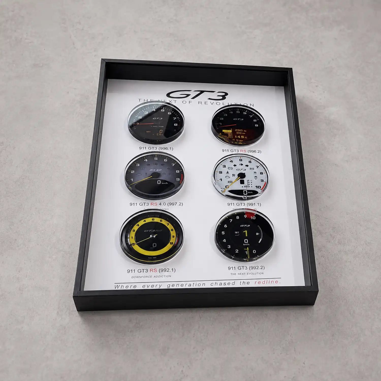 Porsche 911 GT3 Tachometer Evolution 3D Framed Display — flat lay on grey concrete showing all six GT3 tachometer faces