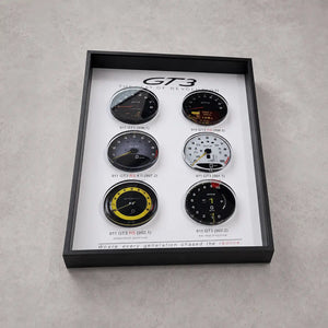 Porsche 911 GT3 Tachometer Evolution 3D Framed Display — flat lay on grey concrete showing all six GT3 tachometer faces